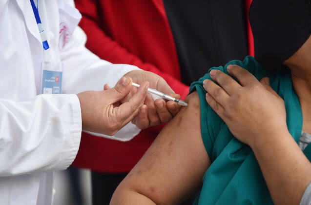 March 13, 2021, Tunis, Tunisia: A Tunisian nurse inoculates a health worker against the covid-19..The Tunisian government says that the aim of this session is to reach 50% of the country s population to vaccinate. The vaccine which is currently being distributed to various stations across the country will first be administered to healthcare workers, teachers and people whose immunity is compromised. Tunis Tunisia - ZUMAs197 20210313_zaa_s197_015 Copyright: xJdidixwassimx