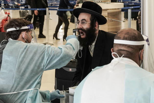 March 14, 2021, Lod, Israel: All incoming travelers at Tel AvivÃ¢â‚¬â ¢s Ben Gurion International Airport are tested for COVID-19 and home quarantine requirement is maintained as government decides to allow a daily quota of 3,000 Israelis to arrive from any destination amid decreasing infection and transmission rates and ahead of national elections for parliament scheduled for 23rd March, 2021. IsraelÃ¢â‚¬â ¢s gateways have been largely closed since 25th January, 2021 and there are estimates of tens of thousands of Israelis still stranded abroad struggling to return for the elections. Lod Israel - ZUMAa126 20210314_zap_a126_001 Copyright: xNirxAlonx