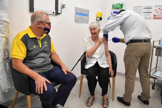 SCOTT MORRISON COVID19 VACCINATION, Australian Prime Minister Scott Morrison joins Aged care resident Jane Malysiak (left) as she receives her second COVID-19 vaccination during a visit to Castle Hill Medical Centre in Sydney, Sunday, March 14, 2021. ( NO ARCHIVING, EDITORIAL USE ONLY, NO USE IN BOOKS WITHOUT CONSENT SYDNEY NSW AUSTRALIA Copyright: xJOELxCARRETTx 20210314001527235682