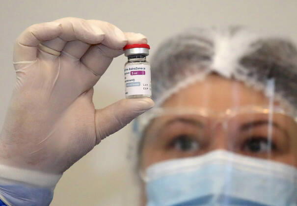 TBILISI, GEORGIA - MARCH 15, 2021: A nurse holds a vial containing the AstraZeneca vaccine against COVID-19 used at the Infectious Diseases, AIFS and Clinical Immunology Research Centre. David Mdzinarishvili TASS  TS0F96A7