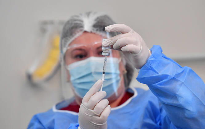 (210315) -- TBILISI, March 15, 2021 -- A nurse demonstrates the COVID-19 vaccine in Tbilisi, Georgia, March 15, 2021. Georgia on March 13 received its first batch of 43,200 doses of a COVID-19 vaccine via the COVAX platform. The AstraZeneca Oxford vaccines are given to priority groups including medical workers from Monday, which marks the beginning of the nationwide vaccination campaign in Georgia, Health Minister Ekaterine Tikaradze said at a news briefing in Tbilisi. (Photo by ) GEORGIA-TBILISI-COVID-19-VACCINATION-CAMPAIGN TamunaxKulumbegashvili 