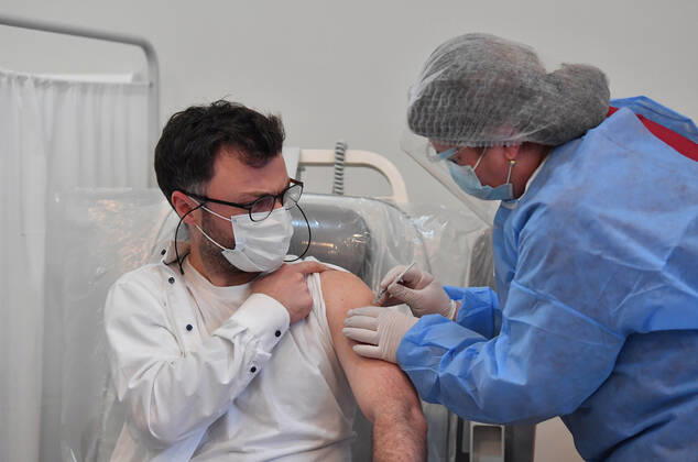(210315) -- TBILISI, March 15, 2021 -- A man receives the COVID-19 vaccine in Tbilisi, Georgia, March 15, 2021. Georgia on March 13 received its first batch of 43,200 doses of a COVID-19 vaccine via the COVAX platform. The AstraZeneca Oxford vaccines are given to priority groups including medical workers from Monday, which marks the beginning of the nationwide vaccination campaign in Georgia, Health Minister Ekaterine Tikaradze said at a news briefing in Tbilisi. (Photo by ) GEORGIA-TBILISI-COVID-19-VACCINATION-CAMPAIGN TamunaxKulumbegashvili 