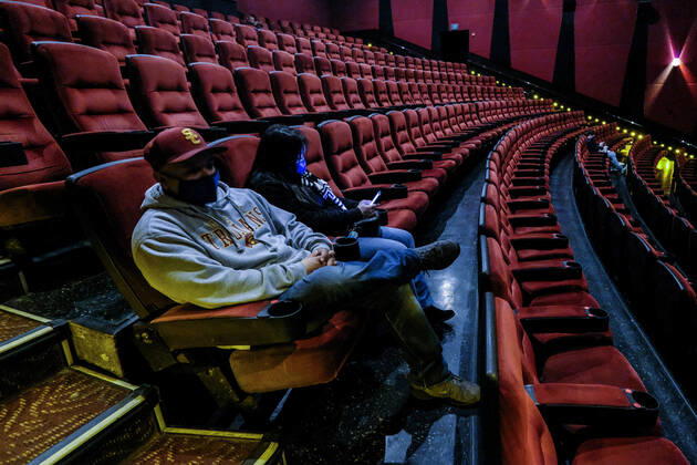 March 15, 2021, Los Angeles, California, USA: Moviegoers sitting in a socially distant seating arrangement at the AMC Theater on the first day of reopened theaters after being closed due to the COVID-19 pandemic in Burbank, California, on March 15, 2021. Los Angeles County restaurants can again welcome customers indoors, and movie theaters and fitness centers are able to reopen, all at limited capacity, with the county advancing today to the less-restrictive red tier of the state s Blueprint for a Safer Economy. Los Angeles USA - ZUMAc68_ 20210315_zaf_c68_010 Copyright: xRingoxChiux
