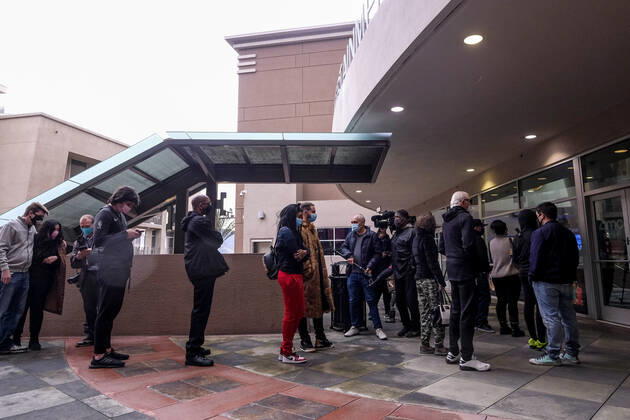 March 15, 2021, Los Angeles, California, USA: Moviegoers wait in line to enter the AMC Theater on the first day of reopened theaters after being closed due to the COVID-19 pandemic in Burbank, California, on March 15, 2021. Los Angeles County restaurants can again welcome customers indoors, and movie theaters and fitness centers are able to reopen, all at limited capacity, with the county advancing today to the less-restrictive red tier of the state s Blueprint for a Safer Economy. Los Angeles USA - ZUMAc68_ 20210315_zaf_c68_016 Copyright: xRingoxChiux