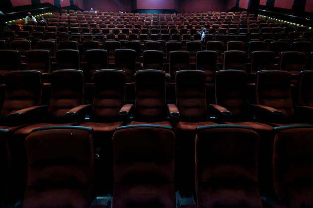 March 15, 2021, Los Angeles, California, USA: Moviegoers sitting in a socially distant seating arrangement at the AMC Theater on the first day of reopened theaters after being closed due to the COVID-19 pandemic in Burbank, California, on March 15, 2021. Los Angeles County restaurants can again welcome customers indoors, and movie theaters and fitness centers are able to reopen, all at limited capacity, with the county advancing today to the less-restrictive red tier of the state s Blueprint for a Safer Economy. Los Angeles USA - ZUMAc68_ 20210315_zaf_c68_018 Copyright: xRingoxChiux