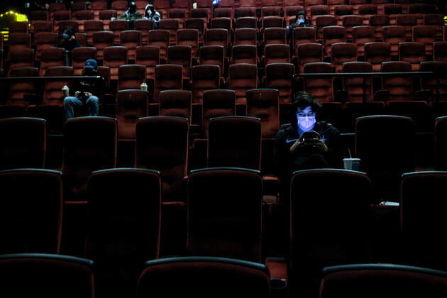 March 15, 2021, Burbank, California, USA: Moviegoers sitting in a socially distant seating arrangement at the AMC Theater on the first day of reopened theaters after being closed due to the COVID-19 pandemic. Movie theaters are able to reopen, all at limited capacity, with the county advancing today to the less-restrictive red tier. Burbank USA - ZUMAc68_ 20210315_zaf_c68_020 Copyright: xRingoxChiux