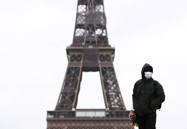 (210317) -- PARIS, March 17, 2021 -- A street vendor is seen at the Trocadero Place near the Eiffel Tower in Paris, France, March 17, 2021. France has entered a form of third wave (of the coronavirus pandemic) characterized by numerous virus variants, Prime Minister Jean Castex said on Tuesday, stressing that his government still considers vaccination a top priority of its strategy to stem the spread of the virus. On Tuesday, the health authorities reported 29,975 new infections across the country, bringing the cumulative total to 4,108,108. The number of single-day deaths jumped to 408, taking the total to 91,170. ) FRANCE-PARIS-COVID-19-THIRD WAVE GaoxJing