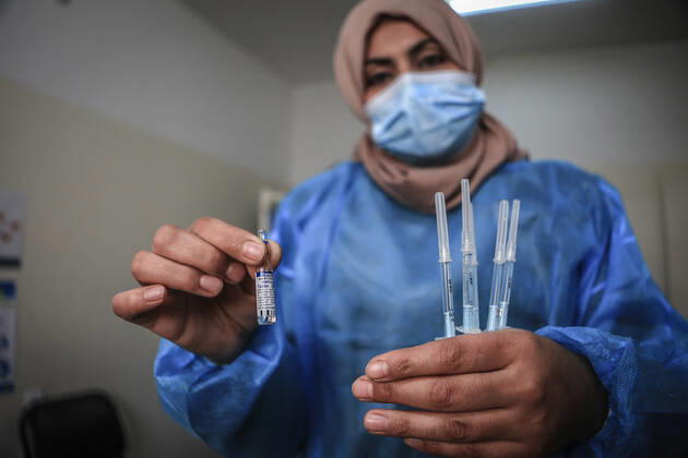 March 17, 2021, Gaza City, The Gaza Strip, Palestine: A shot of the Sputnik V Covid-19 vaccine is prepared to be administered at the Ministry of Health Sabha Al Harazeen clinic, in Al Shejaeiya neighborhood, in the east of Gaza City, 17 March 2021. The Palestinian Authority received on 17 March around 60,000 coronavirus vaccine doses as a first shipment through the COVAX initiative. People start to receive doses of Russia s Sputnik V COVID-19 coronavirus vaccine in the Ministry of Health clinics and United Nations Relief and Works Agency for Palestine Refugees (UNRWA) s clinics. Gaza City Palestine - ZUMAq100 20210317_zaa_q100_004 Copyright: xAbedxAlrahmanxAlkahloutx