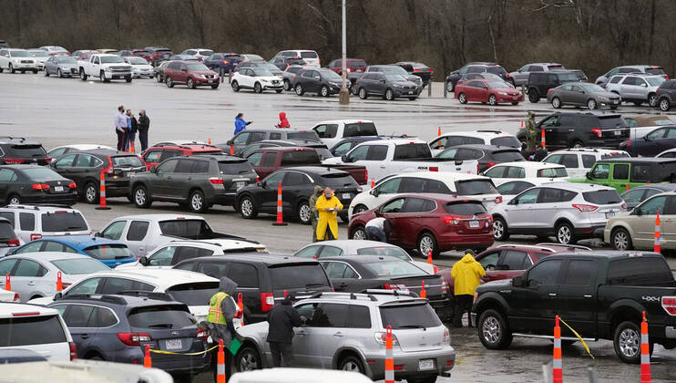 Hundreds wait in their cars to get in line for Covid-19 vaccination shots at the Family Arena during a mass vaccination drive-in event in St. Charles, Missouri on Thursday, March 18, 2021. The event attracted 4,000 people, some waiting over four hours in their cars for their first shot to protect them from the coronavirus.  SLP2021031809 BILLxGREENBLATT