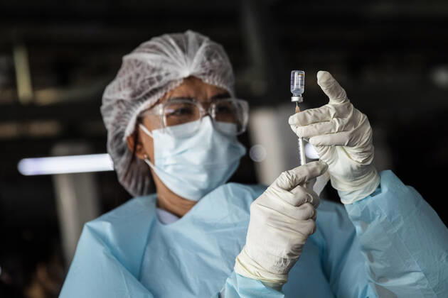 March 19, 2021, Thailand: A health worker prepares a dose of CoronaVac, a Covid-19 coronavirus vaccine developed by Chinaâ€⠢s Sinovac Biotech ltd, in Bangkok, Thailand, on Friday March 19, 2021. Health workers have been vaccinating 600 residents per day, after a cluster of Covid-19 coronavirus cases were discovered at the Bang Khae market in Bangkok on Wednesday, March 17. Thailand - ZUMAm249 20210319_zip_m249_003 Copyright: xAndrexMalerbax