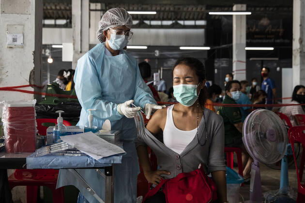 March 19, 2021, Thailand: A health worker administers a dose of CoronaVac, a Covid-19 coronavirus vaccine developed by Chinaâ€⠢s Sinovac Biotech ltd, in Bangkok, Thailand, on Friday March 19, 2021. Health workers have been vaccinating 600 residents per day, after a cluster of Covid-19 coronavirus cases were discovered at the Bang Khae market in Bangkok on Wednesday, March 17. Thailand - ZUMAm249 20210319_zip_m249_005 Copyright: xAndrexMalerbax