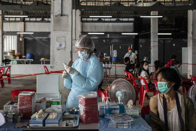 March 19, 2021, Thailand: A health worker administers a dose of CoronaVac, a Covid-19 coronavirus vaccine developed by Chinaâ€⠢s Sinovac Biotech ltd, in Bangkok, Thailand, on Friday March 19, 2021. Health workers have been vaccinating 600 residents per day, after a cluster of Covid-19 coronavirus cases were discovered at the Bang Khae market in Bangkok on Wednesday, March 17. Thailand - ZUMAm249 20210319_zip_m249_010 Copyright: xAndrexMalerbax