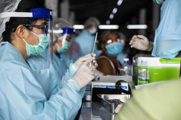 March 19, 2021, Thailand: A health worker prepares a dose of CoronaVac, a Covid-19 coronavirus vaccine developed by Chinaâ€⠢s Sinovac Biotech ltd, in Bangkok, Thailand, on Friday March 19, 2021. Health workers have been vaccinating 600 residents per day, after a cluster of Covid-19 coronavirus cases were discovered at the Bang Khae market in Bangkok on Wednesday, March 17. Thailand - ZUMAm249 20210319_zip_m249_012 Copyright: xAndrexMalerbax