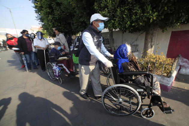 Begins Apply Of Dose Of Sputnik V In Mexico NEZAHUALCOYOTL CITY, MEXICO - MARCH 19: People wait their turn in line to be able to receive a pass and be able to access the vaccination module, where health workers apply the Sputnik V vaccine, during the mass vaccination of the national vaccination program for adults over 60 years old against Covid-19 disease, at Nezahualcoyotl Sports Unit located in municipality of Nezahualcoyotl, State of Mexico. On March 19, 2021 in Nezahualcoyotl City, Mexico. Copyright: xAngelxMoralesxRizox EYEPIXGROUP_AM_19032021_5016