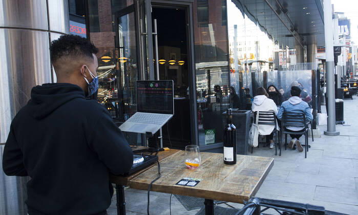 (210320) -- TORONTO, March 20, 2021 -- Customers dine as a DJ plays music at the outdoor area of a restaurant in Toronto, Canada, on March 20, 2021. With distancing rules and a number of other public health and workplace safety measures, outdoor dining was allowed to resume Saturday in Toronto under modifications to the Ontario s color-coded pandemic response framework. (Photo by Xinhua) CANADA-TORONTO-COVID-19-OUTDOOR DINING-RESUME ZouxZheng 