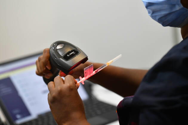 COMMUNITY COVID19 VACCINATION ROLLOUT, A healthcare worker is seen handling a AstraZeneca covid19 vaccination inside of vaccination centre at the Royal Exhibition Building in Melbourne, Monday, March 22, 2021. More than six million Australians are now eligible to receive coronavirus vaccines under a new phase of the national rollout. Phase 1b of the program kicked off across the country on Monday. ( NO ARCHIVING, EDITORIAL USE ONLY, NO USE IN BOOKS WITHOUT CONSENT MELBOURNE VIC AUSTRALIA  Copyright: xJAMESxROSSx 20210322001529290537