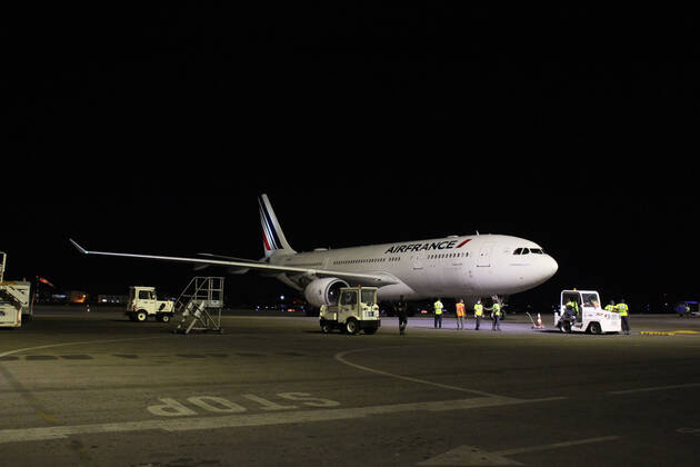 (210322) -- COTONOU, March 22, 2021 -- A plane carrying a batch of coronavirus vaccine developed by the Chinese pharmaceutical company Sinovac arrives at Cardinal Bernadin Gantin International Airport in Cotonou, Benin, March 21, 2021. A batch of coronavirus vaccine developed by the Chinese pharmaceutical company Sinovac arrived in Cotonou, the economic capital of Benin, on Sunday evening. (Photo by Xinhua) BENIN-COTONOU-CHINESE VACCINE-ARRIVAL SeraphinxZounyekpe 