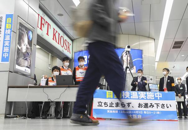 Japan ends COVID-19 state of emergency in Tokyo region Passengers temperatures are monitored near a platform for shinkansen bullet trains arriving from Tokyo at JR Shin-Osaka Station in Osaka on March 22, 2021, after the COVID-19 state of emergency was lifted in the Japanese capital and three neighboring prefectures, the last remaining area of the country that had been under the measure introduced in early January. 