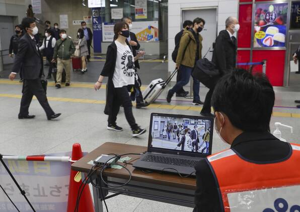 Japan ends COVID-19 state of emergency in Tokyo region Passengers temperatures are monitored near a platform for shinkansen bullet trains arriving from Tokyo at JR Shin-Osaka Station in Osaka on March 22, 2021, after the COVID-19 state of emergency was lifted in the Japanese capital and three neighboring prefectures, the last remaining area of the country that had been under the measure introduced in early January. 