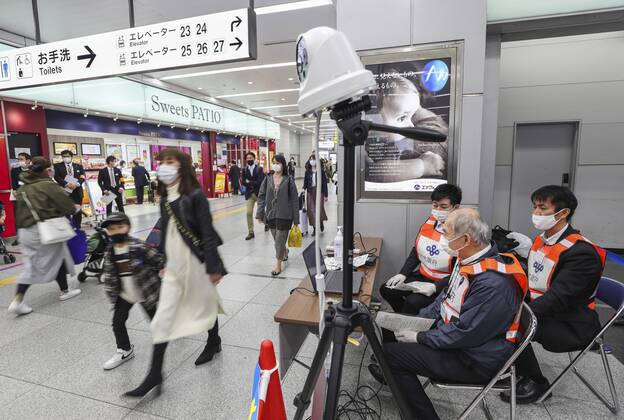 Japan ends COVID-19 state of emergency in Tokyo region Passengers temperatures are monitored near a platform for shinkansen bullet trains arriving from Tokyo at JR Shin-Osaka Station in Osaka on March 22, 2021, after the COVID-19 state of emergency was lifted in the Japanese capital and three neighboring prefectures, the last remaining area of the country that had been under the measure introduced in early January. 