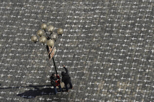 The Million Moments for Democracy civic group honored the memory of those who died with coronavirus by drawing thousands of little crosses at Old Town Square in Prague, Czech Republic, March 22, 2021. The cross should also symbolize the ineffectiveness of the government s COVID combat. (CTKxPhoto KaterinaxSulova) CTKPhotoP202103220299201  _SUK6137