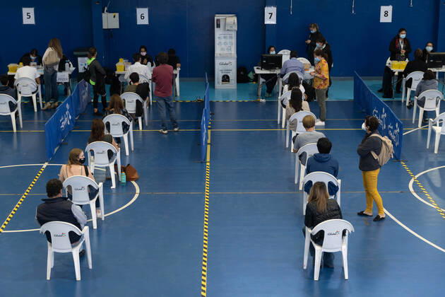 March 22, 2021, Santiago, Metropolitana, Chile: People wait to receive the dose of the Sinovac or Pfizer vaccine, in a municipal stadium transformed into a vaccination center against covid in Santiago, Chile. Santiago Chile - ZUMAb332 20210322_zip_b332_004 Copyright: xMatiasxBasualdox