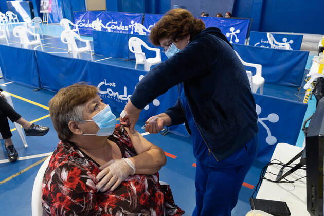 March 22, 2021, Santiago, Metropolitana, Chile: A woman receives a dose of the Sinovac vaccine, in a municipal stadium transformed into a vaccination center against covid in Santiago de Chile. Santiago Chile - ZUMAb332 20210322_zip_b332_018 Copyright: xMatiasxBasualdox