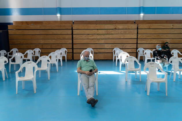 March 22, 2021, Santiago, Metropolitana, Chile: A man waits to receive the dose of the Sinovac or Pfizer vaccine, in a municipal stadium transformed into a vaccination center against covid in Santiago, Chile. Santiago Chile - ZUMAb332 20210322_zip_b332_020 Copyright: xMatiasxBasualdox