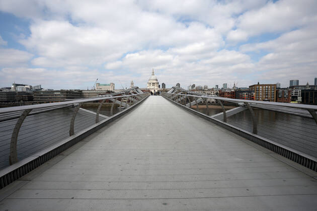 A very quiet Millennium Bridge over the River Thames, with St. Paul s Cathedral in the distance, on the day of reflection. Today marks the first anniversary of the start of UK lockdown restrictions because of the COVID-19 Coronavirus pandemic. A national minute s silence at 12.00pm marks the moment of reflection. London is pictured today (March 23, 2021), on the anniversary of the first Coronavirus lockdown. 