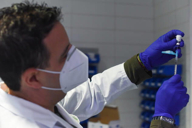 March 24, 2021, Coria, Caceres, Spain: Coria City Hospital nurse, Raul Martin, gets the syringes with the dose ready during the first day of the Astra Zeneca vaccine administration. Coria Spain - ZUMAs197 20210324_zaa_s197_081 Copyright: xGustavoxValientex