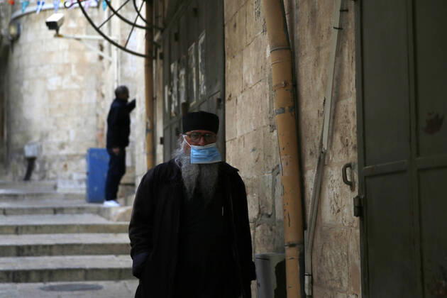 March 25, 2021, Jerusalem, West Bank, Palestinian Territory: Christian worshipers walk inside Church of Holy Sepulcher, amid the coronavirus lockdown, in Jerusalem s Old City, on March 25, 2021. The Palestinian government decided to re-apply the partial closure in the West Bank, with the continued suspension of schools, with the exception of high school students, until April 3 to confront the spread of the Corona virus. The government spokesman said in a statement that it has also been decided that the closure will continue on Friday and Saturday of every week, except for pharmacies and bakeries Jerusalem Palestinian Territory - ZUMAap3_ 20210325_zaf_ap3_092 Copyright: xJamalxAwadx