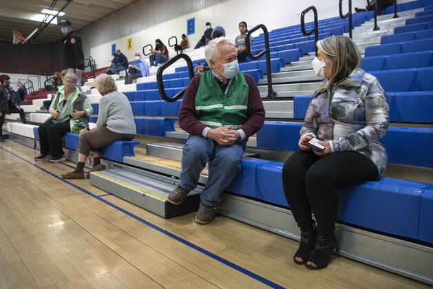 March 26, 2021, USA: Dr. John Ogren, the regional health officer for the New Mexico Department of Health, talks with New Mexico Governor Michelle Lujan Grisham after she received her Pfizer COVID-19 vaccine during a vaccination event held in the gym at Desert Sage Academy in Santa Fe, Friday March 26, 2021. USA - ZUMAab1_ 20210326_zaf_ab1_008 Copyright: xEddiexMoorex