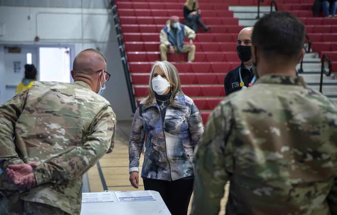 March 26, 2021, USA: New Mexico Governor Michelle Lujan Grisham talks with National Guardsmen after receiving her Pfizer COVID-19 vaccine during a vaccination event held in the gym at Desert Sage Academy in Santa Fe, Friday March 26, 2021. USA - ZUMAab1_ 20210326_zaf_ab1_009 Copyright: xEddiexMoorex
