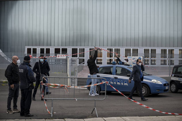 March 26, 2021, Catanzaro, Calabria, Italy: Policemen seen in front of the new hub in Lido district, Catanzaro. Lieutenant general, Francesco Paolo Figliuolo, recently appointed as extraordinary commissioner for the COVID-19 emergency, and Fabrizio Curcio, Head of Department of Civil Protection, visited new vaccination hubs in Calabria. In Catanzaro, in the seacoast district â€oeLidoâ€Â, they visited the new Trade Fair Center selected as potential hub. Sergio Abramo, Mayor of Catanzaro, and Antonino Spirlo¬, and temporary Regional Governor, guided them during the visit. The increasing of vaccination hubs is considered a priority, specially considering the rising number of cases within the region. Catanzaro Italy - ZUMAs197 20210326_zaa_s197_160 Copyright: xValeriaxFerrarox