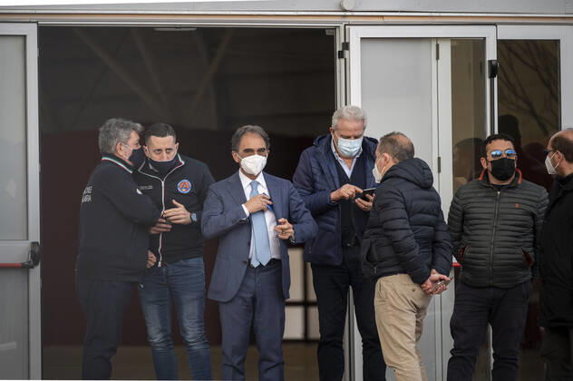 March 26, 2021, Catanzaro, Calabria, Italy: Mayor Sergio Abramo (c) seen among people at the hub. Lieutenant general, Francesco Paolo Figliuolo, recently appointed as extraordinary commissioner for the COVID-19 emergency, and Fabrizio Curcio, Head of Department of Civil Protection, visited new vaccination hubs in Calabria. In Catanzaro, in the seacoast district â€oeLidoâ€Â, they visited the new Trade Fair Center selected as potential hub. Sergio Abramo, Mayor of Catanzaro, and Antonino Spirlo¬, and temporary Regional Governor, guided them during the visit. The increasing of vaccination hubs is considered a priority, specially considering the rising number of cases within the region. Catanzaro Italy - ZUMAs197 20210326_zaa_s197_163 Copyright: xValeriaxFerrarox