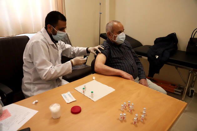 March 27, 2021, Gaza city, Gaza Strip, Palestinian Territory: Palestinians receive the dose of the coronavirus disease (COVID-19) vaccine at the UNRWA clininc, in Gaza city on March 27, 2021. The Palestinian authorities have begun administering vaccines supplied under the international Covax vaccine-sharing scheme, as infections continue to rise sharply in the West Bank and Gaza Gaza city Palestinian Territory - ZUMAap3_ 20210327_zaf_ap3_004 Copyright: xMahmoudxAjjourx