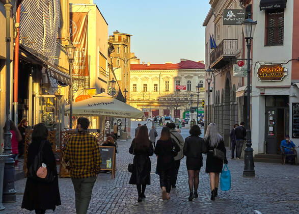 Old town with restaurants and bars with tourists and local people in Bucharest, Romania on March 27, 2021.