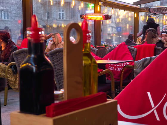 Old town with restaurants and bars with tourists and local people in Bucharest, Romania on March 27, 2021.