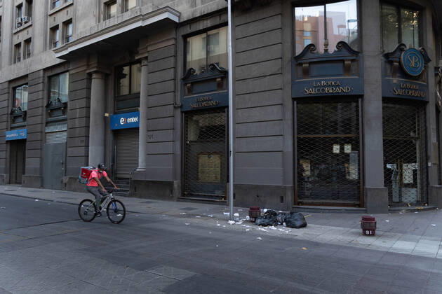 March 27, 2021, Santiago, Metropolitana, Chile: A cyclist passes through an empty street, on the first day of total quarantine in Santiago, Chile. Santiago Chile - ZUMAb332 20210327_zip_b332_010 Copyright: xMatiasxBasualdox