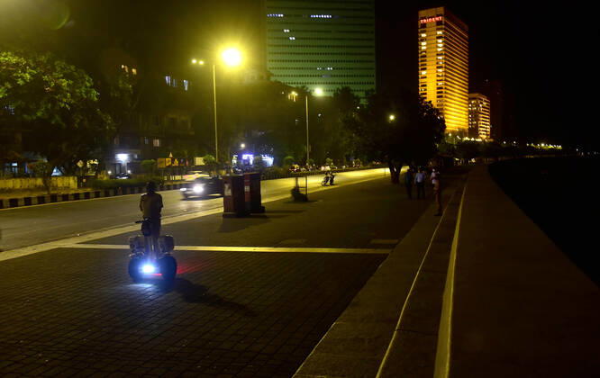 MUMBAI, INDIA - MARCH 28: Police on Segway patrolling Marine Drive after a night curfew between 8:00 pm to 7:00 am came into effect, on March 28, 2021 in Mumbai, India. (Photo by Anshuman Poyrekar Hindustan Times) Covid 19 Night Curfew In Mumbai Tourists Spot Wear Deserted Look