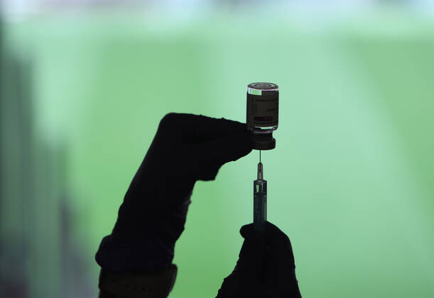 A health professional holds a syringe and a vial with the Covid-19 vaccine, in a device installed at the Wanda Metropolitano Stadium, in Madrid, Spain, on March 30, 2021. The Community of Madrid has begun to vaccinate this Tuesday against Covid-19 to the general population aged 60 to 65 years with doses of AstraZeneca. Also, next week will begin to vaccinate people aged 77, 78 and 79 years with doses of Pfizer. 30 MARCH 2021;WANDA METROPOLITANO;MADRID;COMMUNITY OF MADRID Marta Fernandez Jara LagenciaEP 03 30 2021 MADRID MADRID Spain Copyright: xMartaxFernandezxJarax 3627703