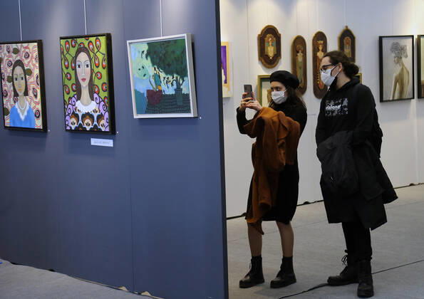 (210330) -- ANKARA, March 30, 2021 -- People wearing face masks visit an international contemporary art fair in Ankara, Turkey, on March 30, 2021. (Photo by Xinhua) TURKEY-ANKARA-INTERNATIONAL CONTEMPORARY ART FAIR MustafaxKaya 