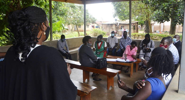 (210331) -- KAMPALA, March 31, 2021 -- Teachers attend COVID-19 vaccination campaign at a health center in Kampala, capital of Uganda, March 31, 2021. Uganda launched the first phase of COVID-19 vaccination campaign on March 10, targeting high risk groups in the east African country. The ministry of health targets to vaccinate more than 21.9 million people who face the highest risk of the infection, which include health workers, teachers, security personnel, elderly and those with underlying medical conditions. (Photo by Xinhua) UGANDA-KAMPALA-TEACHERS-VACCINATION NicholasxKajoba