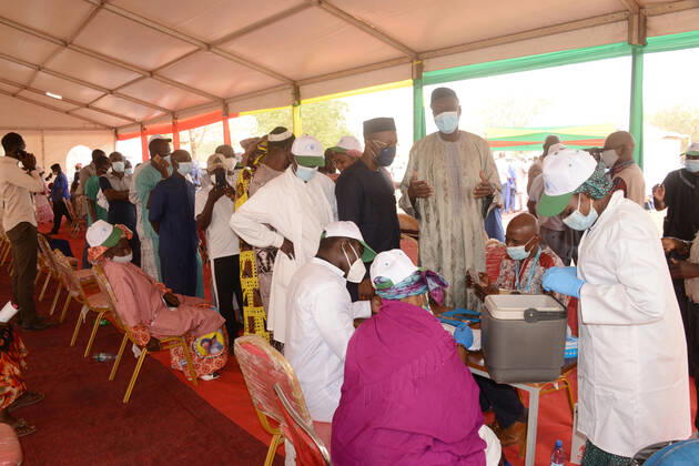 (210331) -- BAMAKO, March 31, 2021 -- People line up to register before receiving the COVID-19 vaccine in Bamako, Mali, on March 31, 2021. Malian Minister of Health and Social Development Fanta Siby received Wednesday her first dose of COVID-19 vaccine, which symbolized the official kickoff of Mali s COVID-19 vaccination campaign. During this first phase of the vaccination campaign, according to the minister, a total of 21,406 health workers will be vaccinated in Bamako, epicenter of the pandemic in this West African country. (Photo by Xinhua) MALI-BAMAKO-COVID-19-VACCINATION HabibxKouyate 