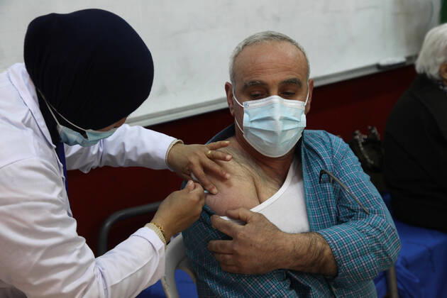 (210401) -- RAMALLAH, April 1, 2021 -- A man receives Sinopharm COVID-19 vaccine during a vaccination campaign in the West Bank city of Ramallah, on April 1, 2021. China on Monday handed over a batch of donated Sinopharm COVID-19 vaccines to Palestine to support its nationwide fight against the pandemic. (Photo by Xinhua) MIDEAST-RAMALLAH-COVID-19-VACCINATION NidalxEshtayeh 