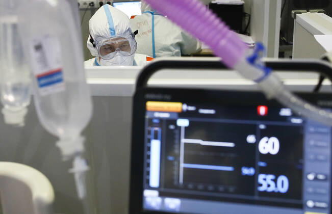 MOSCOW, RUSSIA - APRIL 1, 2021: A medical worker is seen at a temporary COVID-19 hospital at the Sokolniki Exhibition and Convention Center. The treatment facility has a reserve hospital and an observation center; its capacity is 550 beds, including 18 for intensive therapy patients. Sergei Bobylev TASS  TS0FB33F