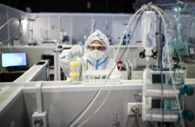 MOSCOW, RUSSIA - APRIL 1, 2021: A medical worker is seen at a temporary COVID-19 hospital at the Sokolniki Exhibition and Convention Center. The treatment facility has a reserve hospital and an observation center; its capacity is 550 beds, including 18 for intensive therapy patients. Sergei Bobylev TASS  TS0FB3B1