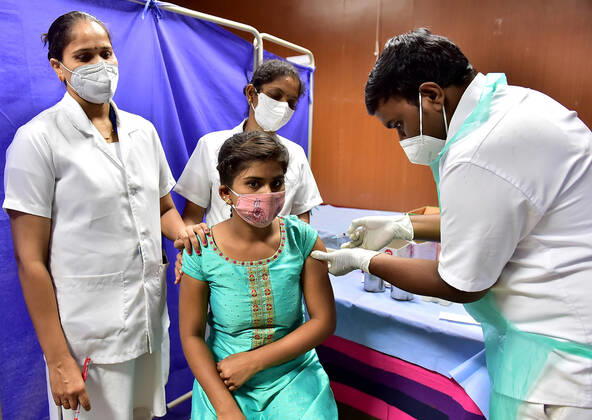 (210401) -- BANGALORE, April 1, 2021 -- A woman receives the COVID-19 vaccine at a hospital in Bangalore, India, April 1, 2021. The third phase of vaccination to curb the COVID-19 pandemic began in India on Thursday, during which all people aged above 45 years would be given vaccine jabs. (Str Xinhua) INDIA-BANGALORE-COVID-19-VACCINATION Stringer 