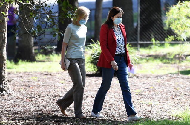 ANNASTACIA PALASZCZUK COVID19 PRESSER, Queensland Chief Health Officer Jeannette Young (left) and Queensland Premier Annastacia Palaszczuk (right) are seen arriving for a press conference in Brisbane, Friday, April 2, 2021.Premier Palaszczuk announced that Queensland has recorded eight new cases of Coronavirus (COVID-19) today with seven acquired overseas and detected in hotel quarantine, but no community transmission. ( NO ARCHIVING, EDITORIAL USE ONLY, NO USE IN BOOKS WITHOUT CONSENT BRISBANE QLD AUSTRALIA  Copyright: xDARRENxENGLANDx 20210402001531807164