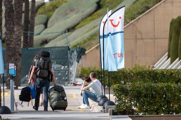 20210401 Tourists arrive at Palma de Mallorca Airport PALMA, SPAIN - APRIL 1 2021 : Tourists arriving in the TUI transfer Area at Palma de Mallorca Ariport at - Tourists arrive at Palma de Mallorca Airport on April 1, 2021 in Palma, .